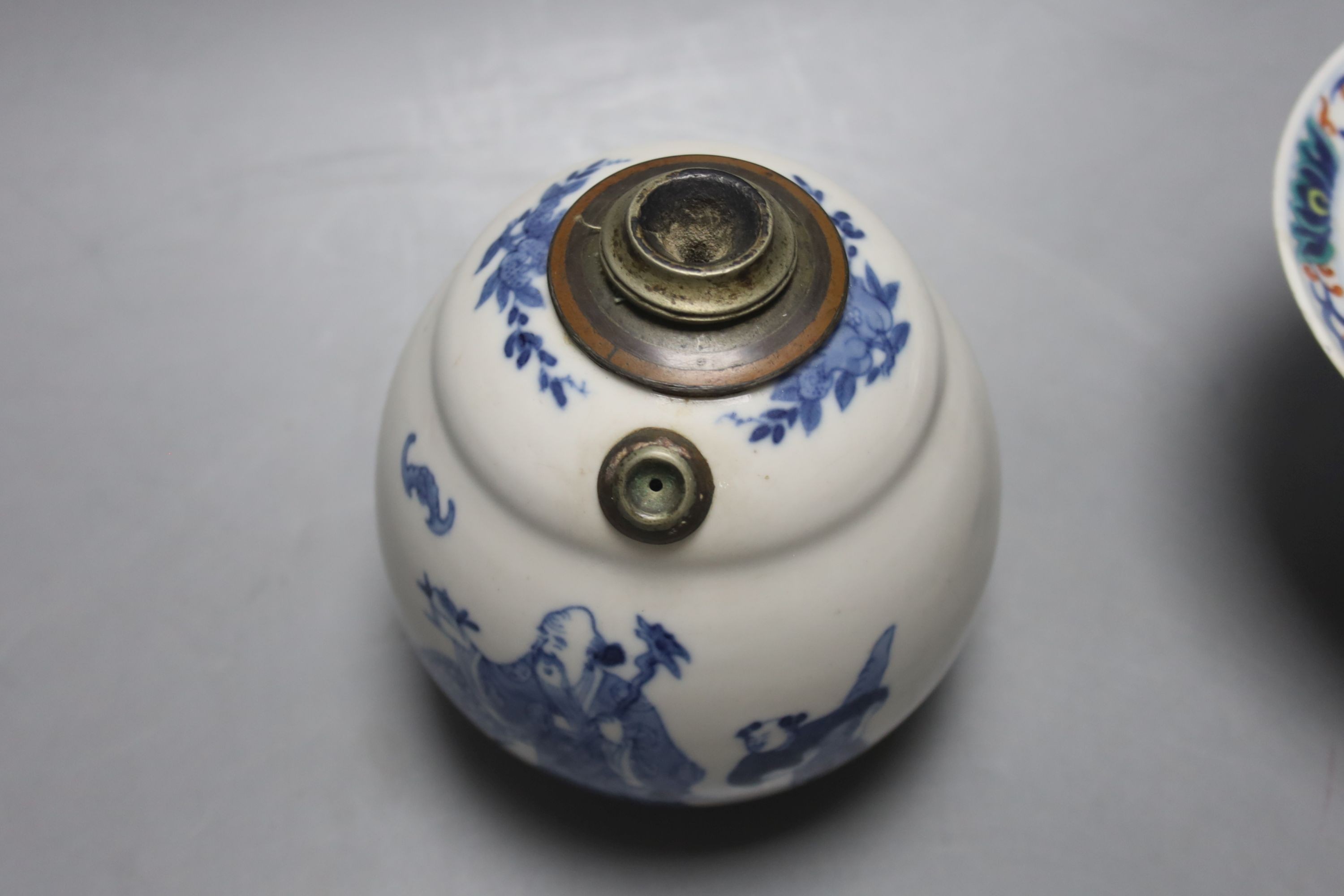 A Chinese blue and white water pipe vessel, a doucai stem dish and a Japanese Imari bowl, 19th century, (3)